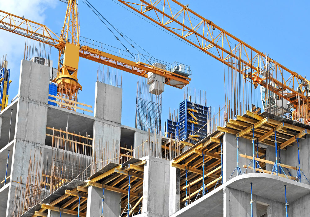 Several Orange Cranes On Construction Sites